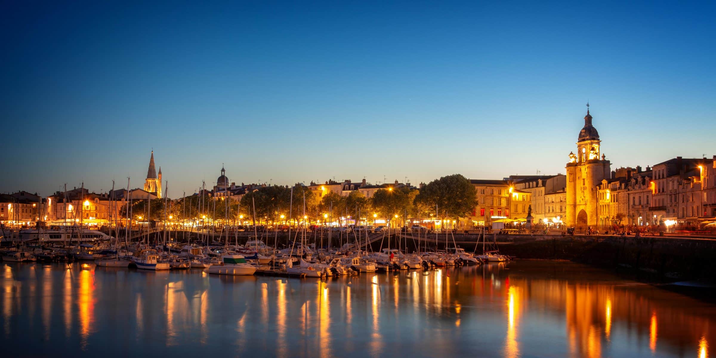 Old harbor of La Rochelle, France at night